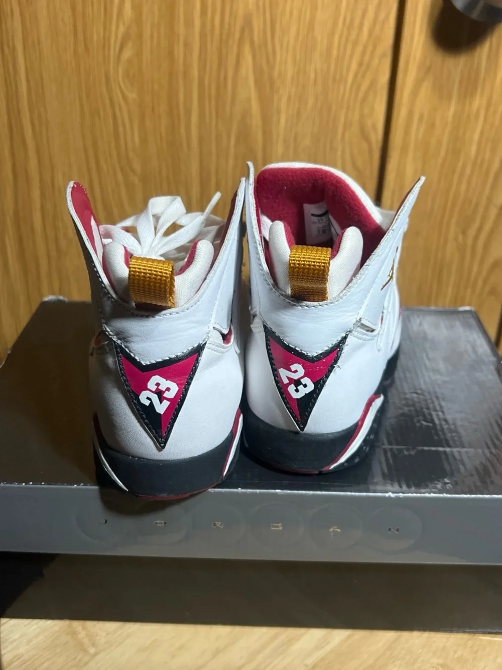 Jordan Kids White High-Top Sneakers with Pink Lining and Yellow Heel Tabs